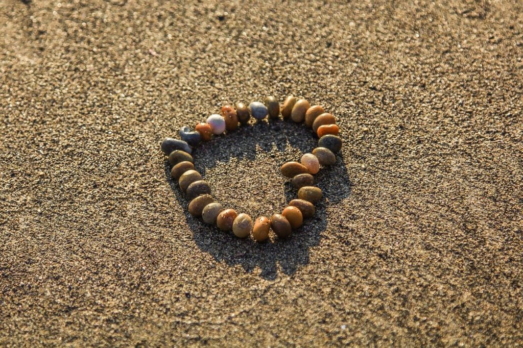 heart, pebbles, sand